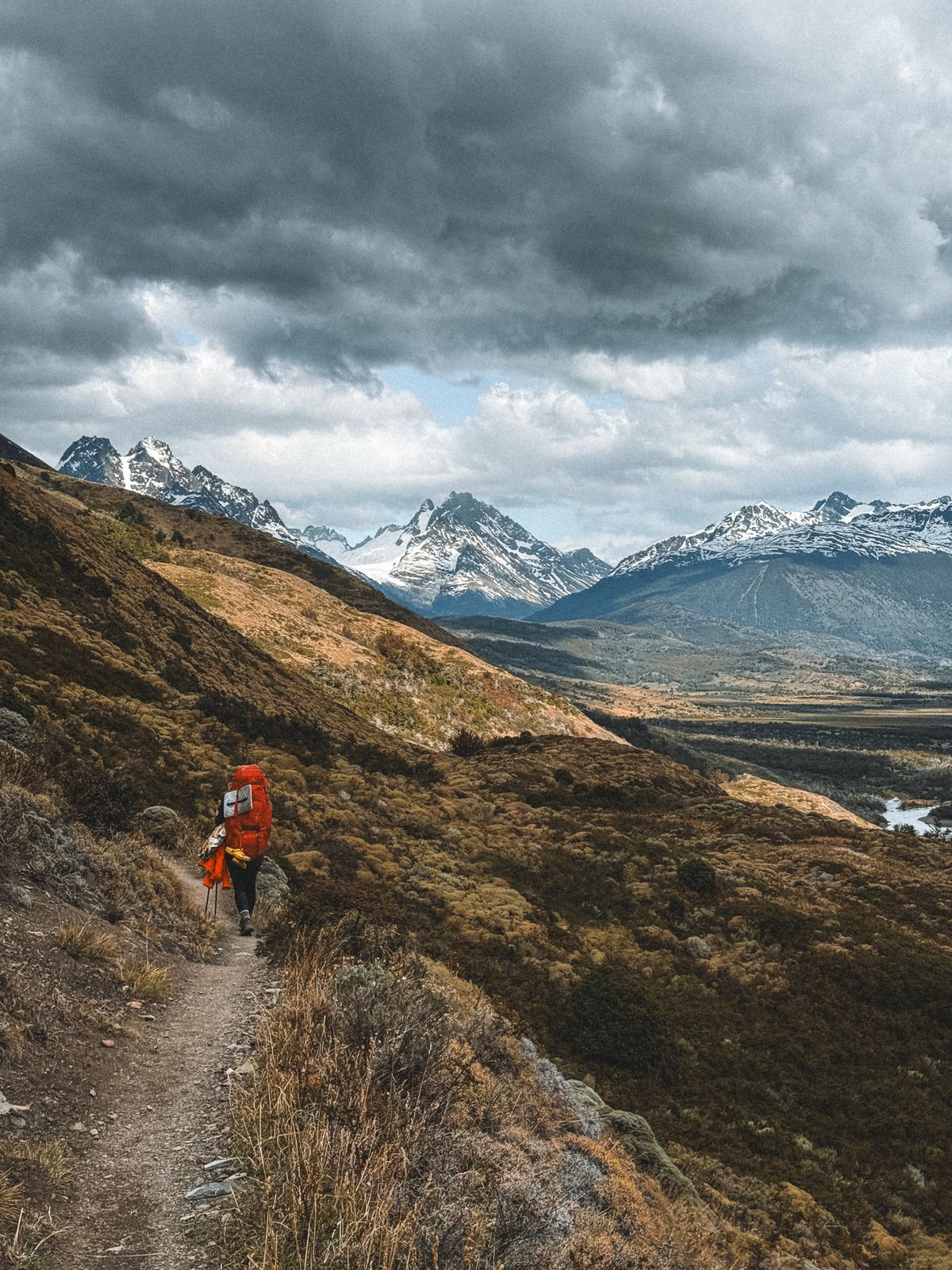 A hiker on a mountain trail in Chilean Patagonia