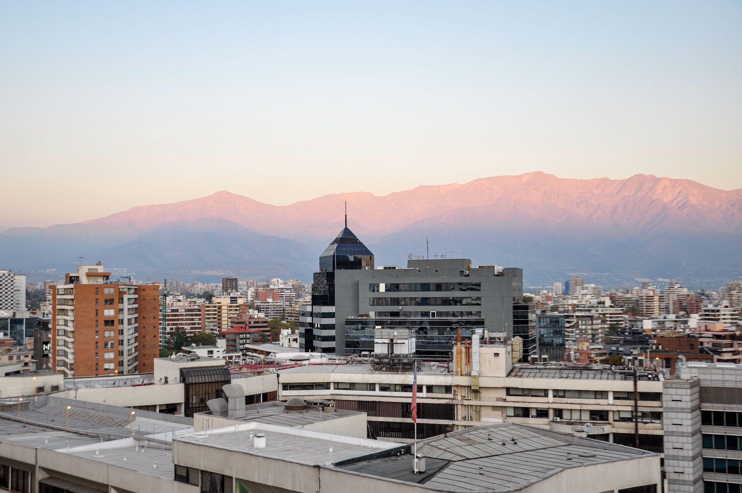 Alpenglow on the Andes above the Santiago skyline at sunset